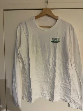 Tates Long-Sleeve Crewneck Tee in White with Green Logo